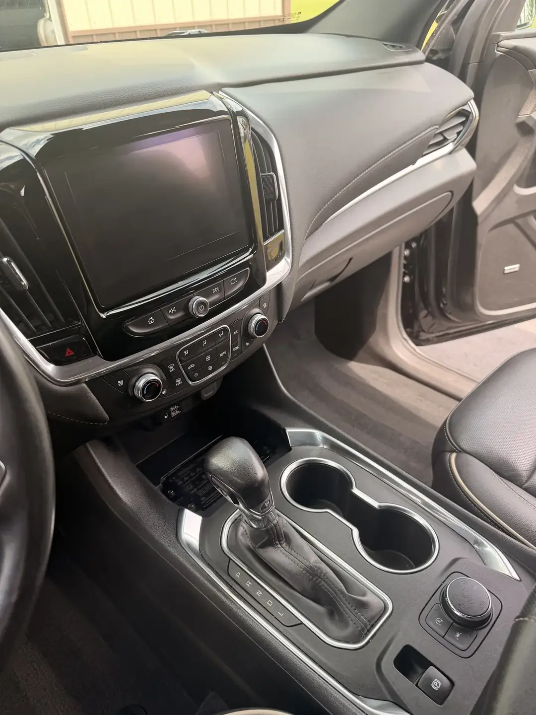 Center console and dash of an SUV, detailed